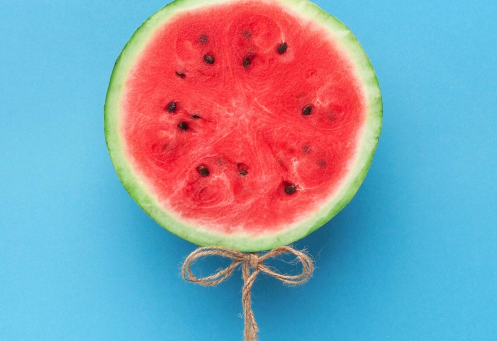 watermelon-balloon-on-blue-background-creative-57PNH8Q-2000x1125